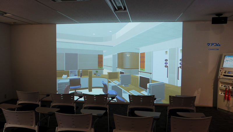 巨大スクリーンに表示された病棟の3DCG映像